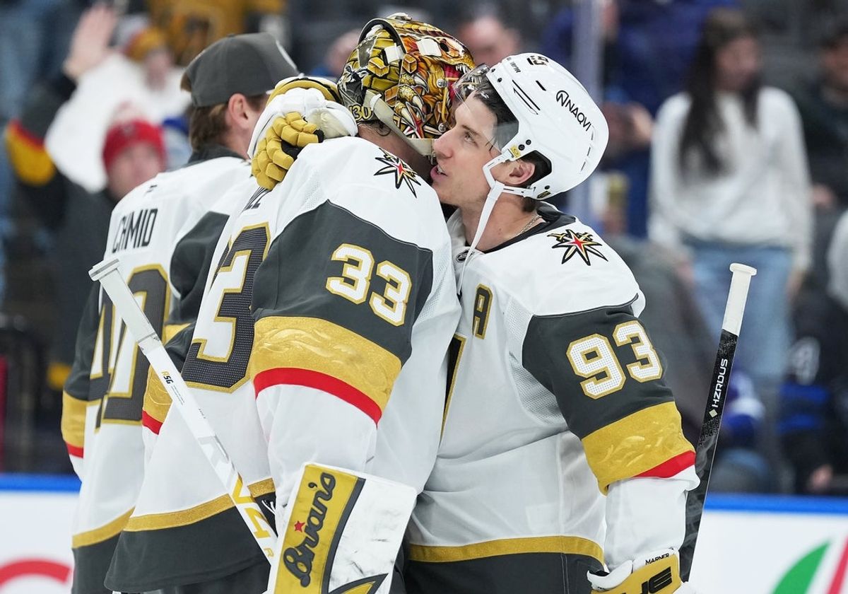 Jan 23, 2026; Toronto, Ontario, CAN; Vegas Golden Knights right wing Mitch Marner (93) celebrates the win with goaltender Adin Hill (33) against the Toronto Maple Leafs at the end of the third period at Scotiabank Arena. Mandatory Credit: Nick Turchiaro-Imagn Images