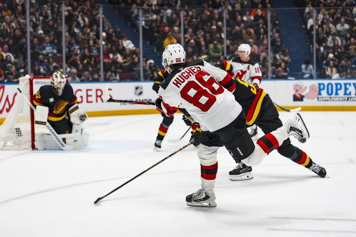 Jan 23, 2026; Vancouver, British Columbia, CAN; New Jersey Devils forward Jack Hughes (86) shoots against the Vancouver Canucks in the first period at Rogers Arena. Mandatory Credit: Bob Frid-Imagn Images