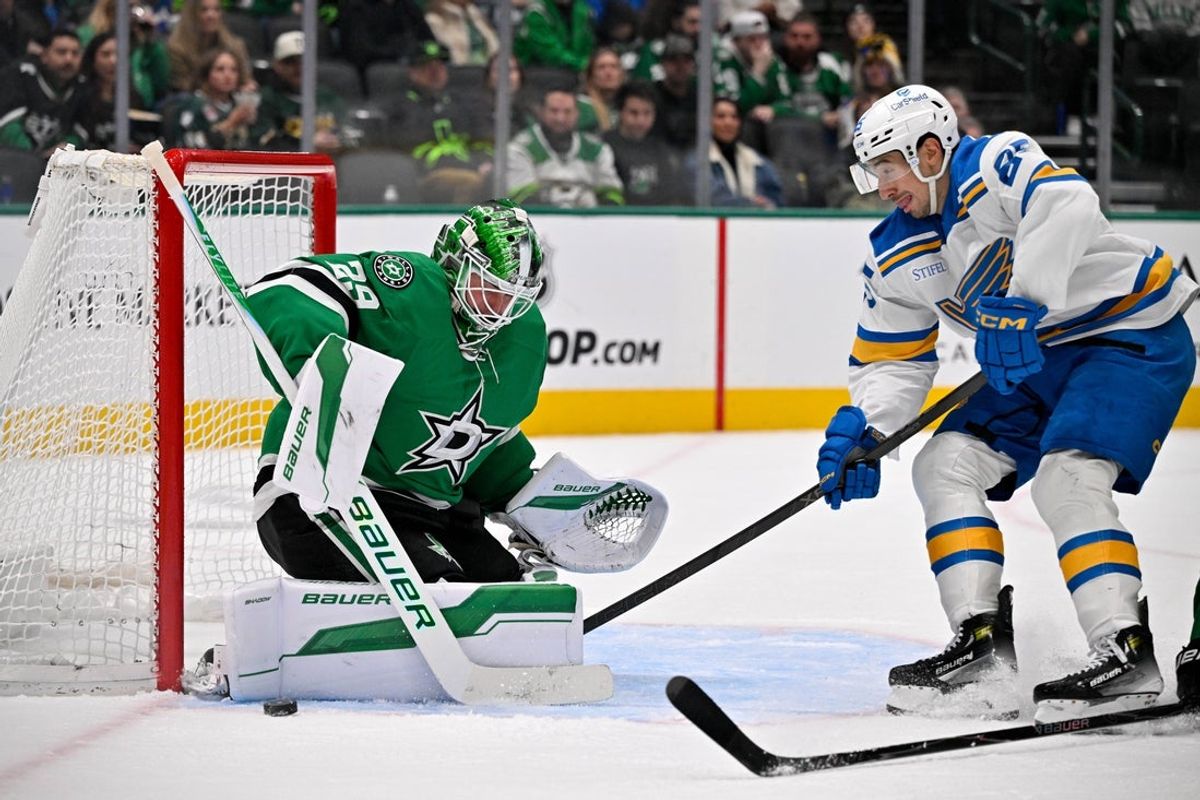 Jan 23, 2026; Dallas, Texas, USA; Dallas Stars goaltender Jake Oettinger (29) stops a shot by St. Louis Blues right wing Jordan Kyrou (25) during the third period at the American Airlines Center. Mandatory Credit: Jerome Miron-Imagn Images