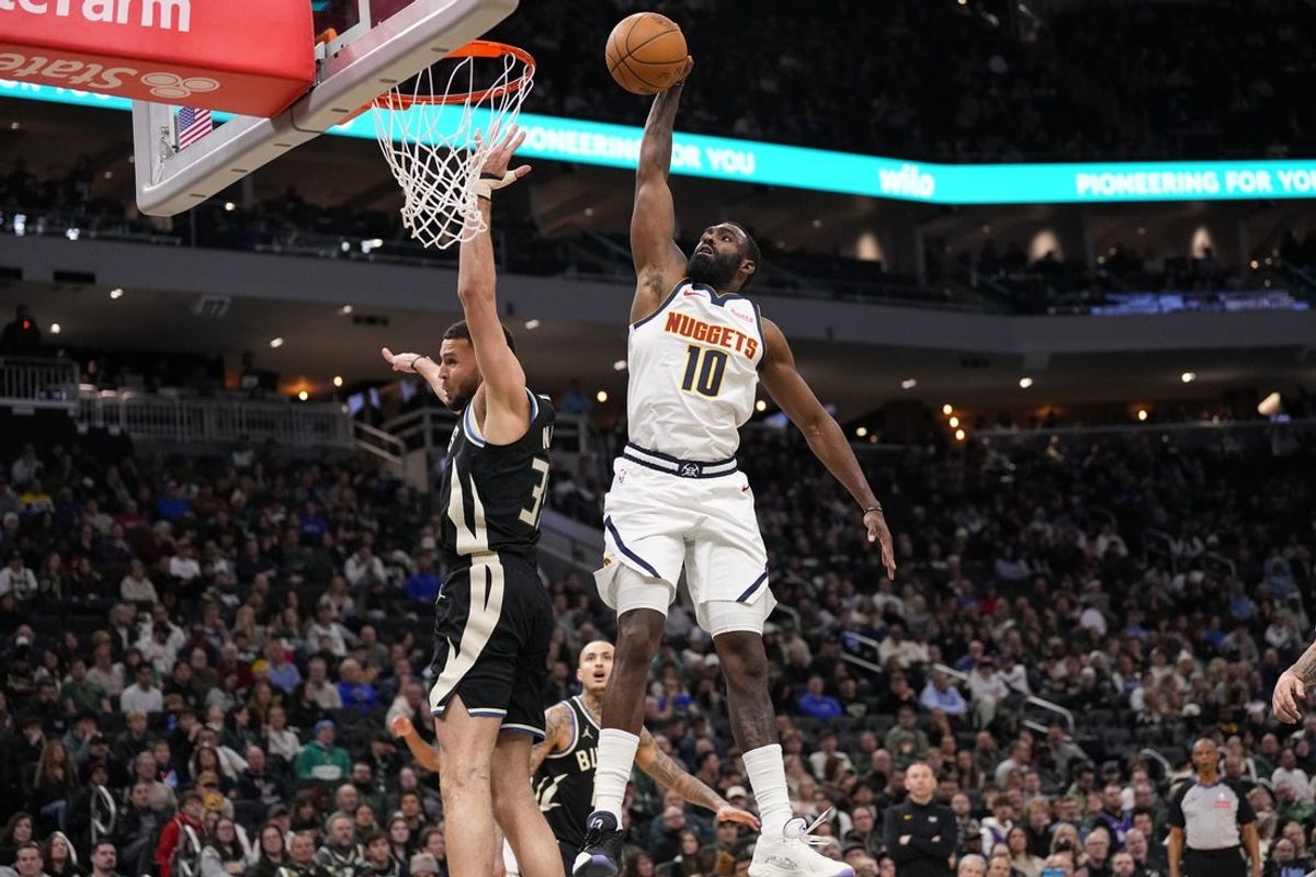 Jan 23, 2026; Milwaukee, Wisconsin, USA;  Denver Nuggets forward Tim Hardaway Jr. (10) dunks during the third quarter against the Milwaukee Bucks at Fiserv Forum. Mandatory Credit: Jeff Hanisch-Imagn Images
