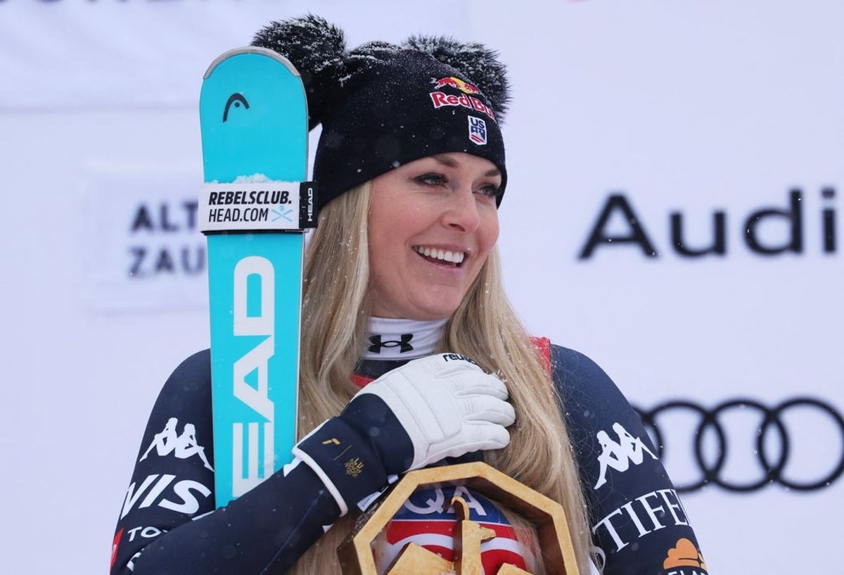 [US, Mexico & Canada customers only] Jan 10, 2026; Zauchensee, AUSTRIA; Lindsey Vonn of the United States celebrates on the podium after winning the women's downhill alpine skiing race in the FIS World Cup at Zauchensee. Mandatory Credit: Leonhard Foeger/Reuters via Imagn Images