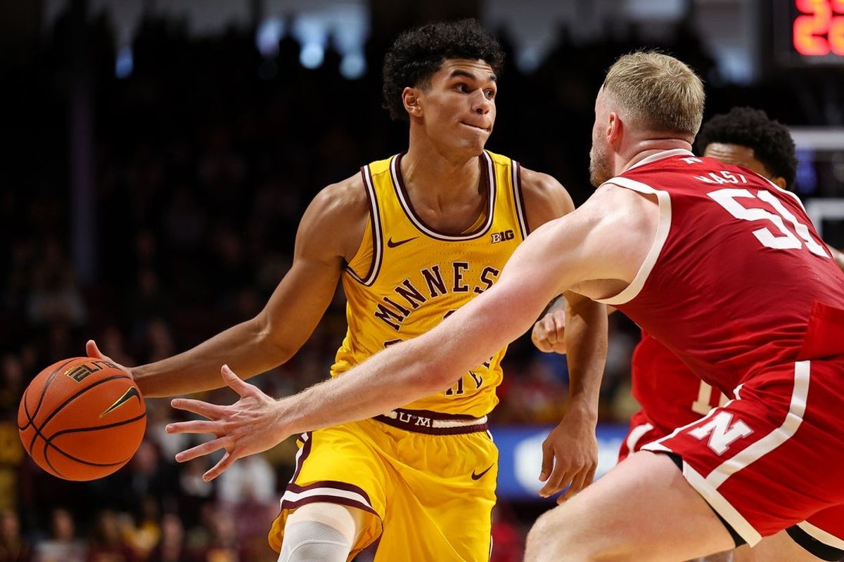 Jan 24, 2026; Minneapolis, Minnesota, USA; Minnesota Golden Gophers guard Isaac Asuma (1) works around Nebraska Cornhuskers forward Rienk Mast (51) during the first half at Williams Arena. Mandatory Credit: Matt Krohn-Imagn Images
