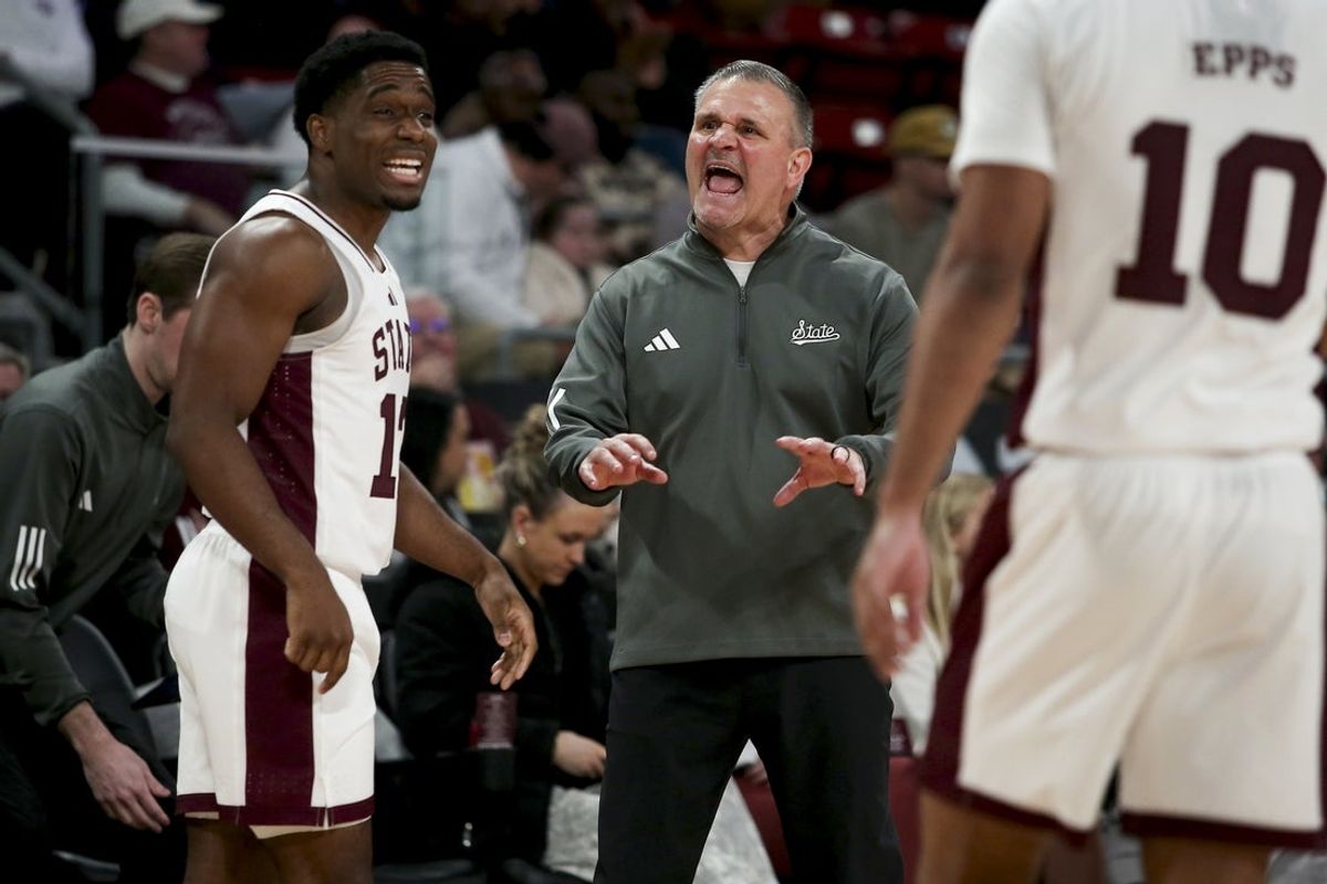 Jan 24, 2026; Starkville, Mississippi, USA; Mississippi State Bulldogs guard Josh Hubbard (12) and head coach Chris Jans react during the first half against the Vanderbilt Commodores at Humphrey Coliseum. Mandatory Credit: Petre Thomas-Imagn Images
