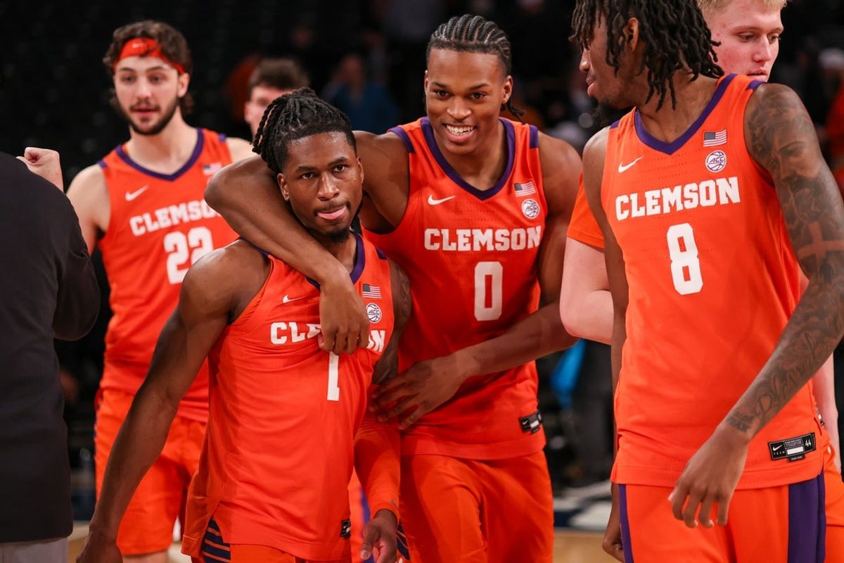 Jan 24, 2026; Atlanta, Georgia, USA; Clemson Tigers guard Jestin Porter (1) and forward RJ Godfrey (0) and forward Dallas Thomas (8) celebrate after a victory over the Georgia Tech Yellow Jackets at McCamish Pavilion. Mandatory Credit: Brett Davis-Imagn Images