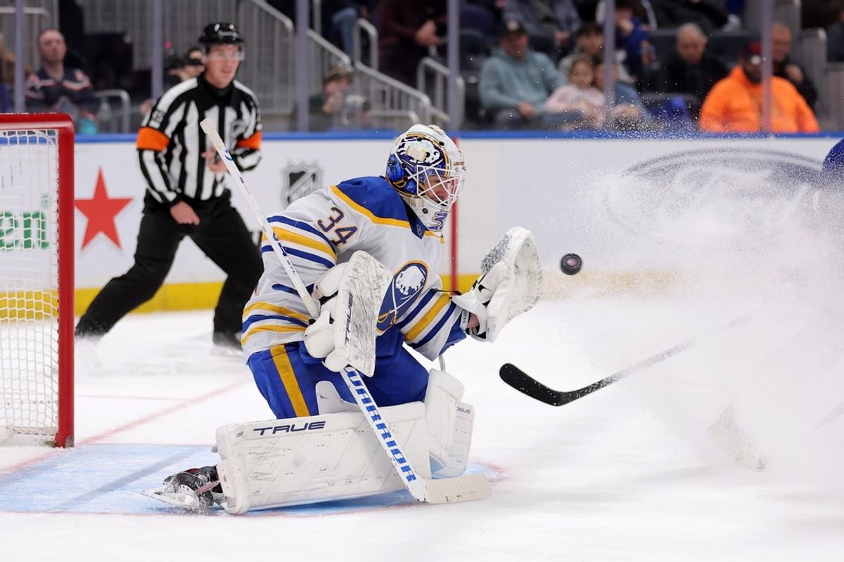Jan 24, 2026; Elmont, New York, USA; Buffalo Sabres goaltender Alex Lyon (34) makes a save against the New York Islanders during the second period at UBS Arena. Mandatory Credit: Brad Penner-Imagn Images