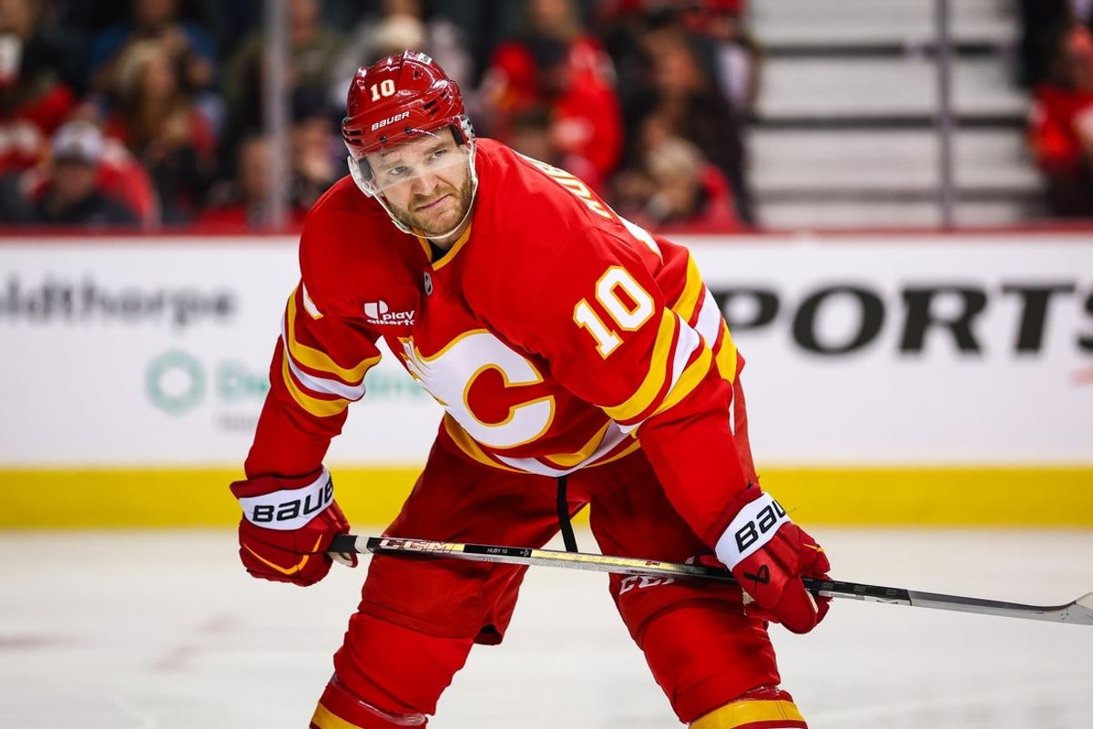 Jan 23, 2026; Calgary, Alberta, CAN; Calgary Flames left wing Jonathan Huberdeau (10) against the Washington Capitals during the second period at Scotiabank Saddledome. Mandatory Credit: Sergei Belski-Imagn Images