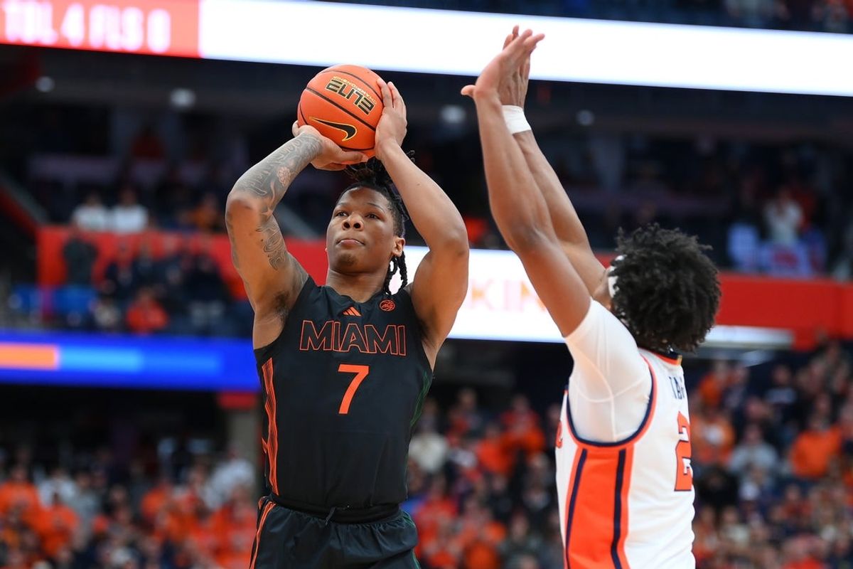 Jan 24, 2026; Syracuse, New York, USA; Miami Hurricanes forward Shelton Henderson (7) shoots against Syracuse Orange guard J.J. Starling (2) during the first half at the JMA Wireless Dome. Mandatory Credit: Rich Barnes-Imagn Images