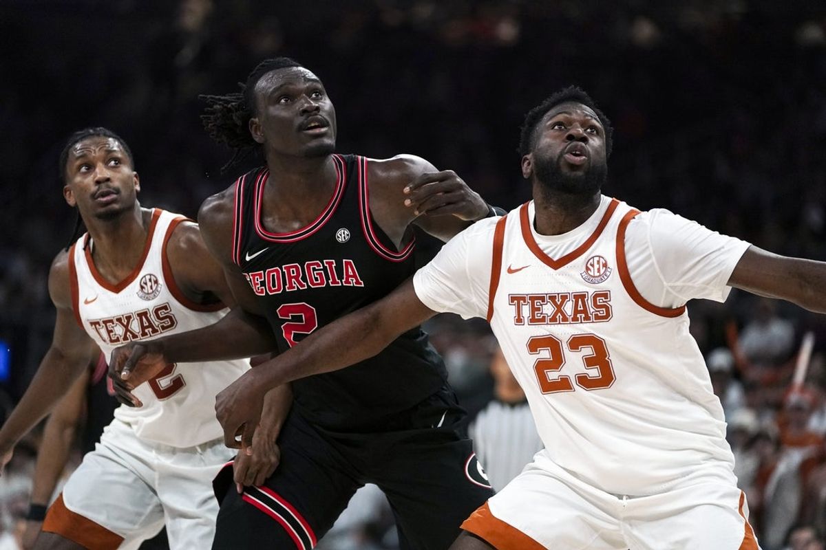 Jan 24, 2026; Austin, Texas, USA; Texas Longhorns forward Lassina Traore (23) blocks Georgia Bulldogs center Somtochukwu Cyril (2) during a free throw in the second half at Moody Center. Mandatory Credit: Dustin Safranek-Imagn Images