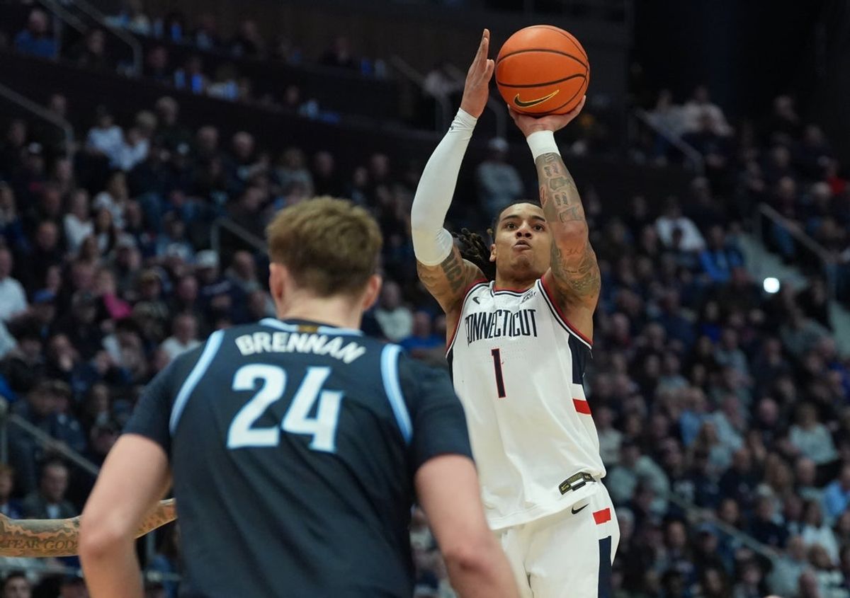 Jan 24, 2026; Storrs, Connecticut, USA; UConn Huskies guard Solo Ball (1) shoots the ball against the Villanova Wildcats in the second half at Harry A. Gampel Pavilion. Mandatory Credit: David Butler II-Imagn Images