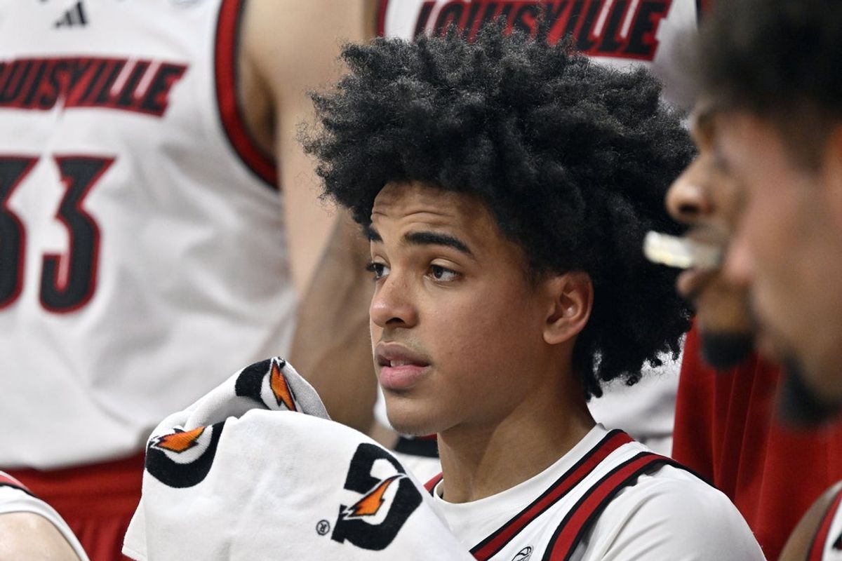 Jan 24, 2026; Louisville, Kentucky, USA;  Louisville Cardinals guard Mikel Brown Jr. (0) listens while in a time out during the second half against the Virginia Tech Hokies at KFC Yum! Center. Mandatory Credit: Jamie Rhodes-Imagn Images