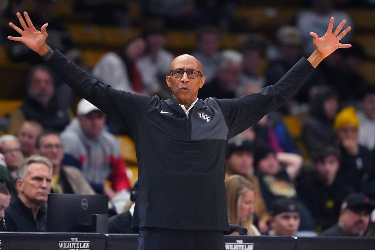 Jan 24, 2026; Boulder, Colorado, USA; UCF Knights head coach Johnny Dawkins calls out in the second half against the Colorado Buffaloes at the CU Events Center. Mandatory Credit: Ron Chenoy-Imagn Images