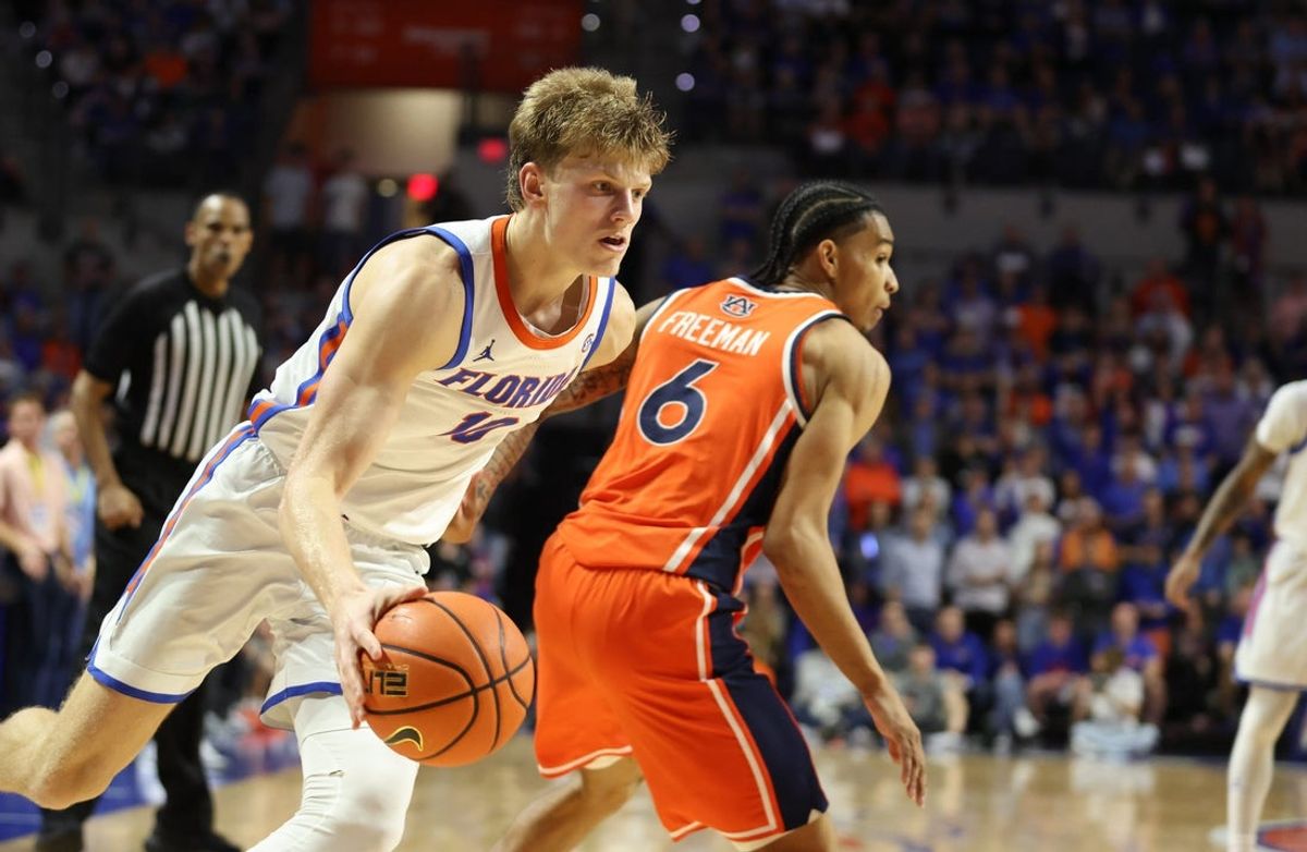 Florida forward Thomas Haugh (10) get past Auburn guard Elyjah Freeman (6) during the second half an NCAA basketball game at Steven C. O'Connell Center Exactek arena in Gainesville, FL on Saturday, January 24, 2026. Auburn won 76-67 [Alan Youngblood/Gainesville Sun]