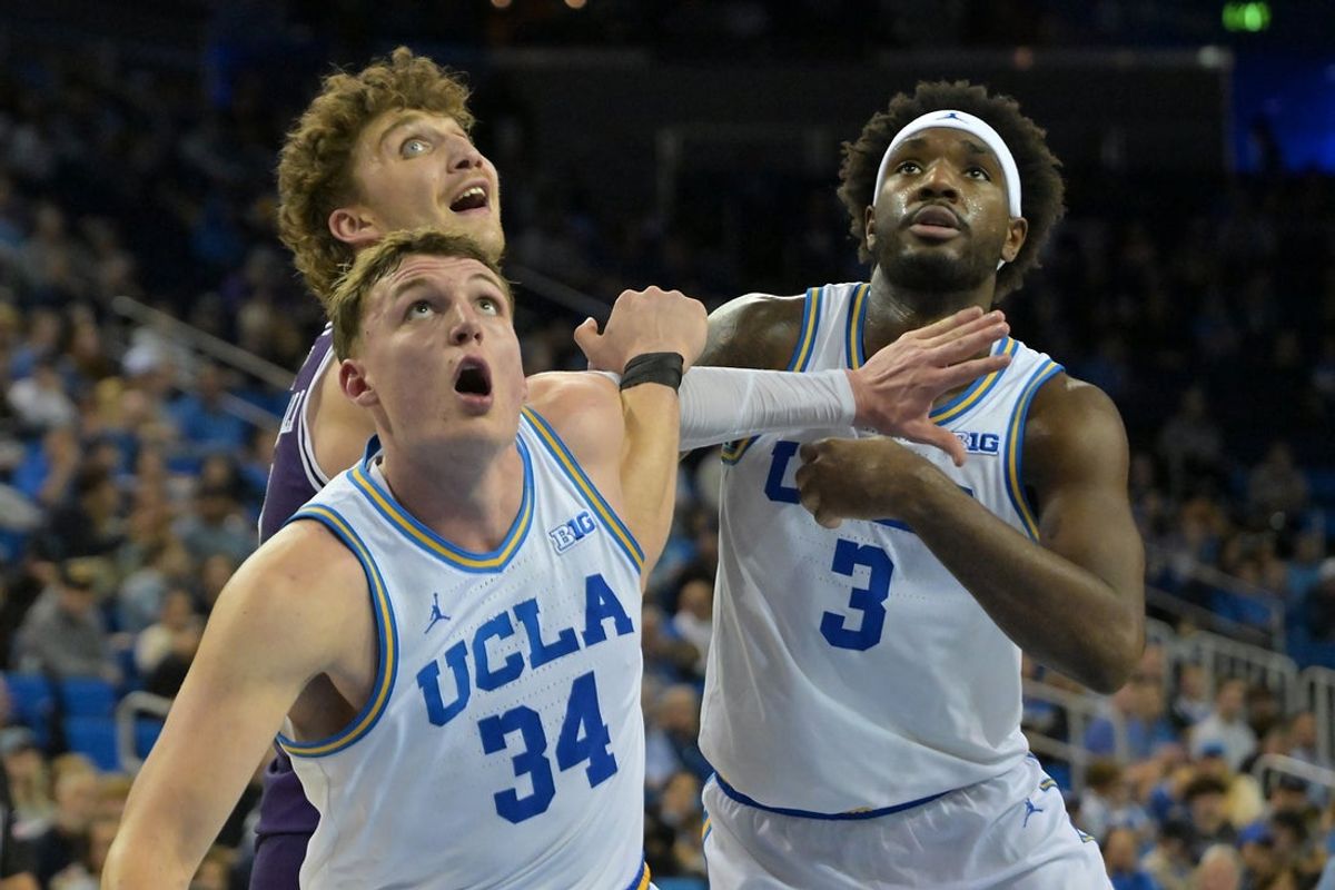 Jan 24, 2026; Los Angeles, California, USA;  UCLA Bruins forward Tyler Bilodeau (34) and guard Eric Dailey Jr. (3) box out Northwestern Wildcats forward Nick Martinelli (2) in the second half at Pauley Pavilion presented by Wescom Financial. Mandatory Credit: Jayne Kamin-Oncea-Imagn Images