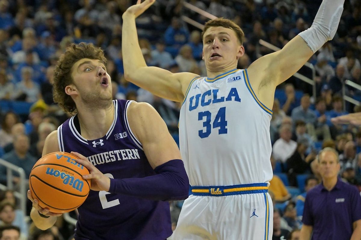 Jan 24, 2026; Los Angeles, California, USA;  Northwestern Wildcats forward Nick Martinelli (2) is defended by UCLA Bruins forward Tyler Bilodeau (34) as he drives to the basket in the second half at Pauley Pavilion presented by Wescom Financial. Mandatory Credit: Jayne Kamin-Oncea-Imagn Images