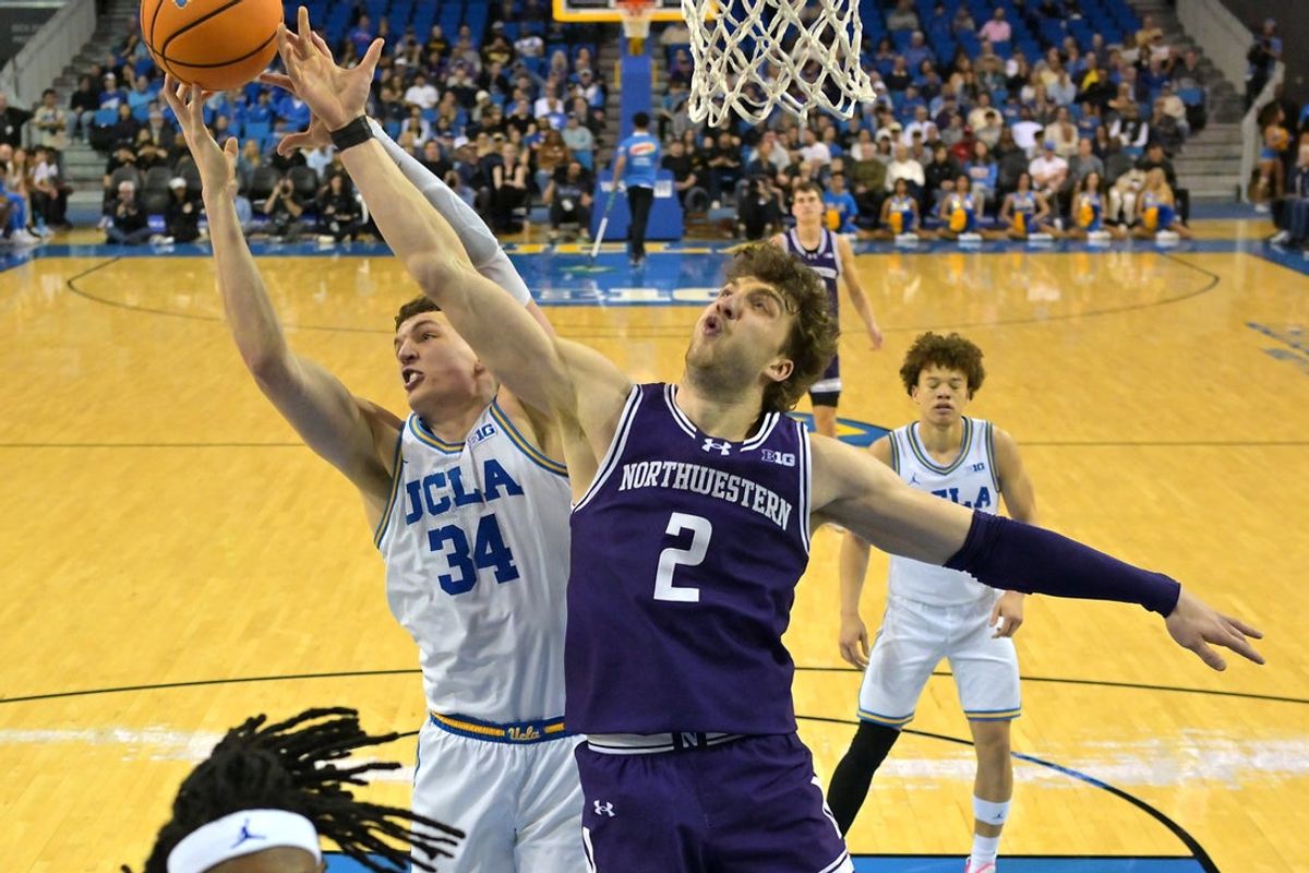Jan 24, 2026; Los Angeles, California, USA;  UCLA Bruins forward Tyler Bilodeau (34) and Northwestern Wildcats forward Nick Martinelli (2) go for a rebound in the first half at Pauley Pavilion presented by Wescom Financial. Mandatory Credit: Jayne Kamin-Oncea-Imagn Images