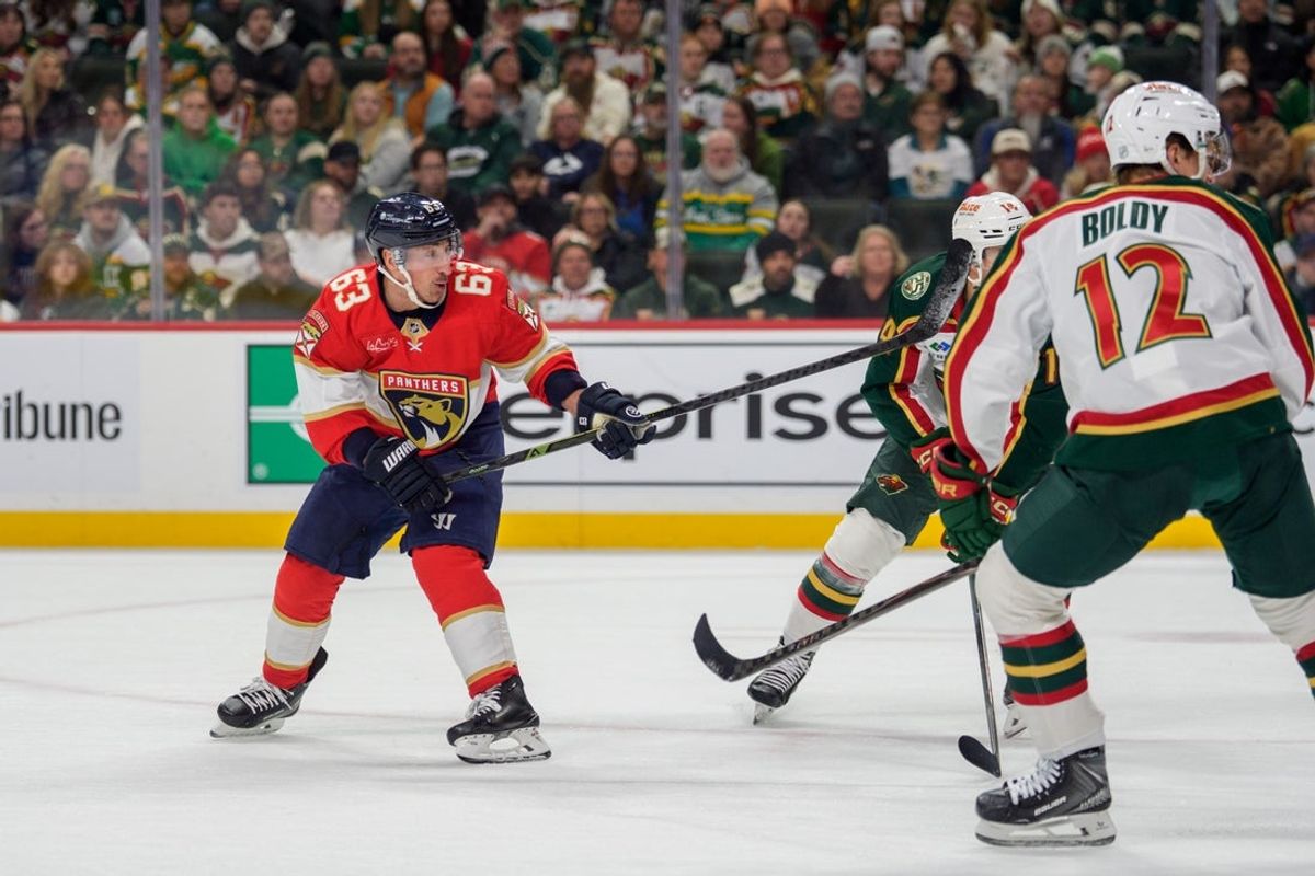 Jan 24, 2026; Saint Paul, Minnesota, USA; Florida Panthers left wing Brad Marchand (63) shoots and scores against the Minnesota Wild in the first period at Grand Casino Arena. Mandatory Credit: Matt Blewett-Imagn Images