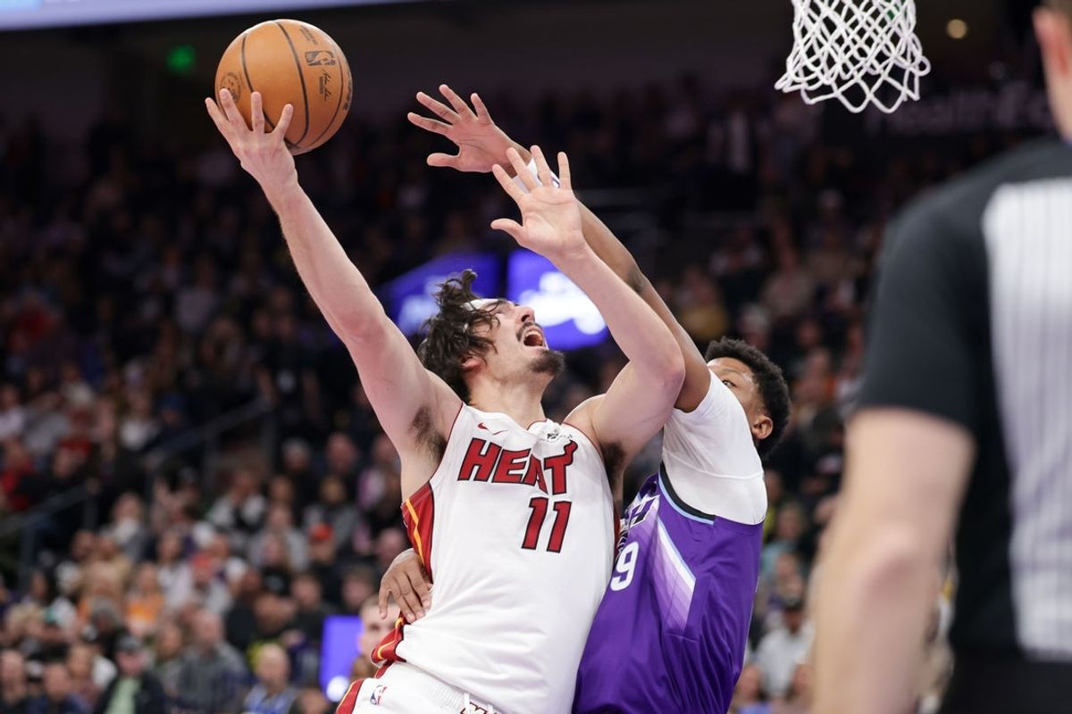 Jan 24, 2026; Salt Lake City, Utah, USA;  Miami Heat guard Jaime Jaquez Jr. (11) is fouled by Utah Jazz forward Ace Bailey (19) while shooting the ball during the first quarter at Delta Center. Mandatory Credit: Chris Nicoll-Imagn Images