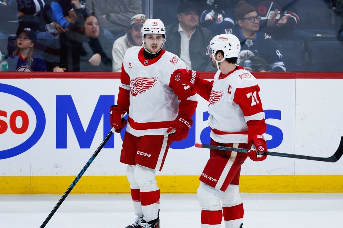 Jan 24, 2026; Winnipeg, Manitoba, CAN; Detroit Red Wings forward Marco Kasper (92) is congratulated by forward Dylan Larkin (71) on his goal against the Winnipeg Jets during the third period at Canada Life Centre. Mandatory Credit: Terrence Lee-Imagn Images