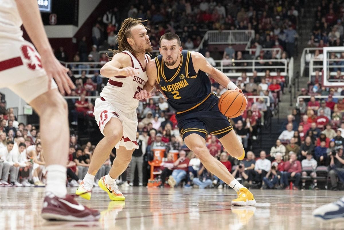 Jan 24, 2026; Stanford, California, USA;  California Golden Bears forward John Camden (2) drives the ball around Stanford Cardinal guard Jeremy Dent-Smith (25) during the second half at Maples Pavilion. Mandatory Credit: Stan Szeto-Imagn Images