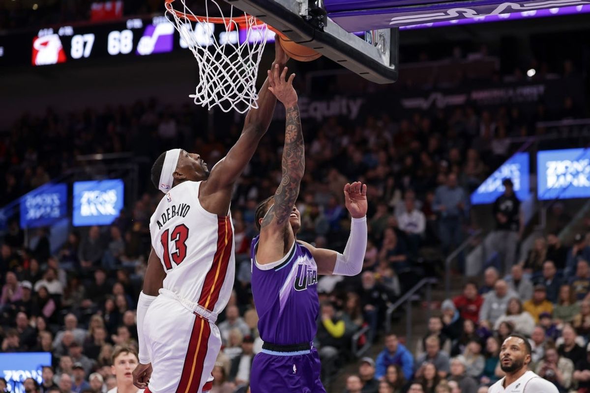 Jan 24, 2026; Salt Lake City, Utah, USA;  Miami Heat center/forward Bam Adebayo (13) blocks the shot of Utah Jazz guard Keyonte George (3) during the second half at Delta Center. Mandatory Credit: Chris Nicoll-Imagn Images