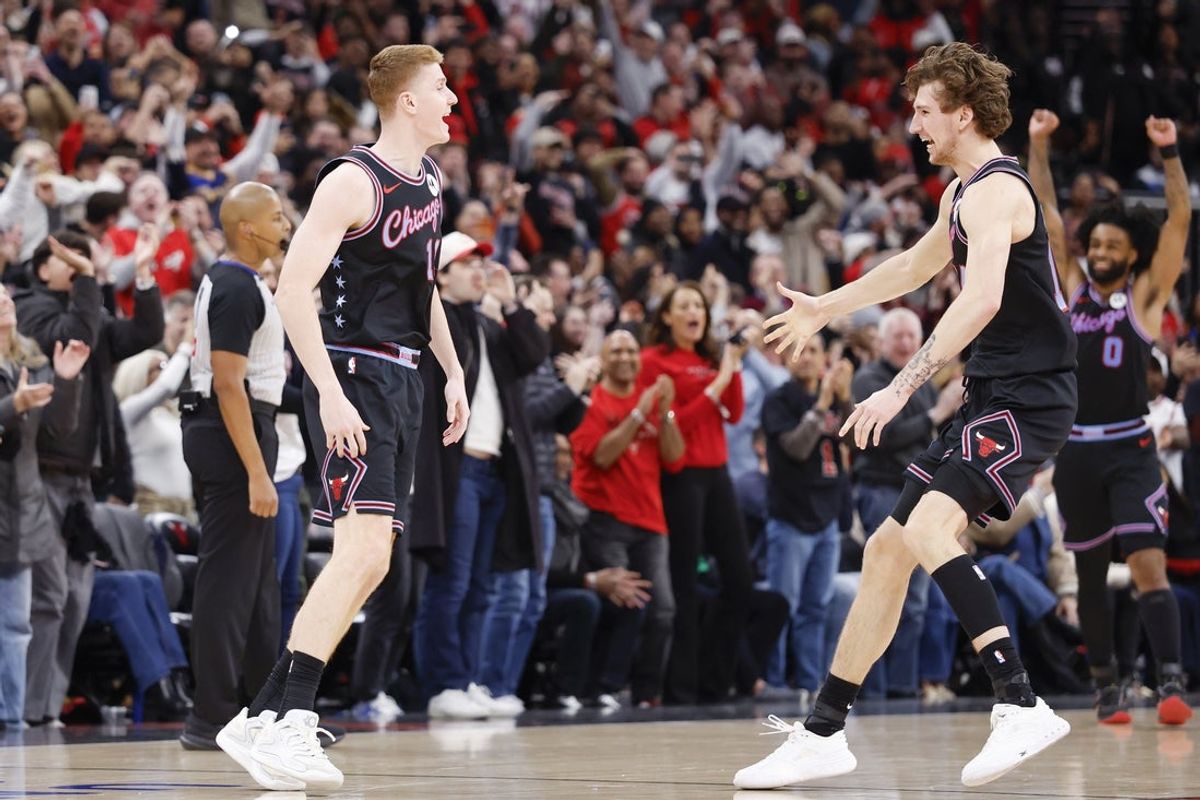 Jan 24, 2026; Chicago, Illinois, USA; Chicago Bulls guard Kevin Huerter (13) celebrates with forward Matas Buzelis (14) after scoring a game winning three-pointer against the Boston Celtics during the second half at United Center. Mandatory Credit: Kamil Krzaczynski-Imagn Images