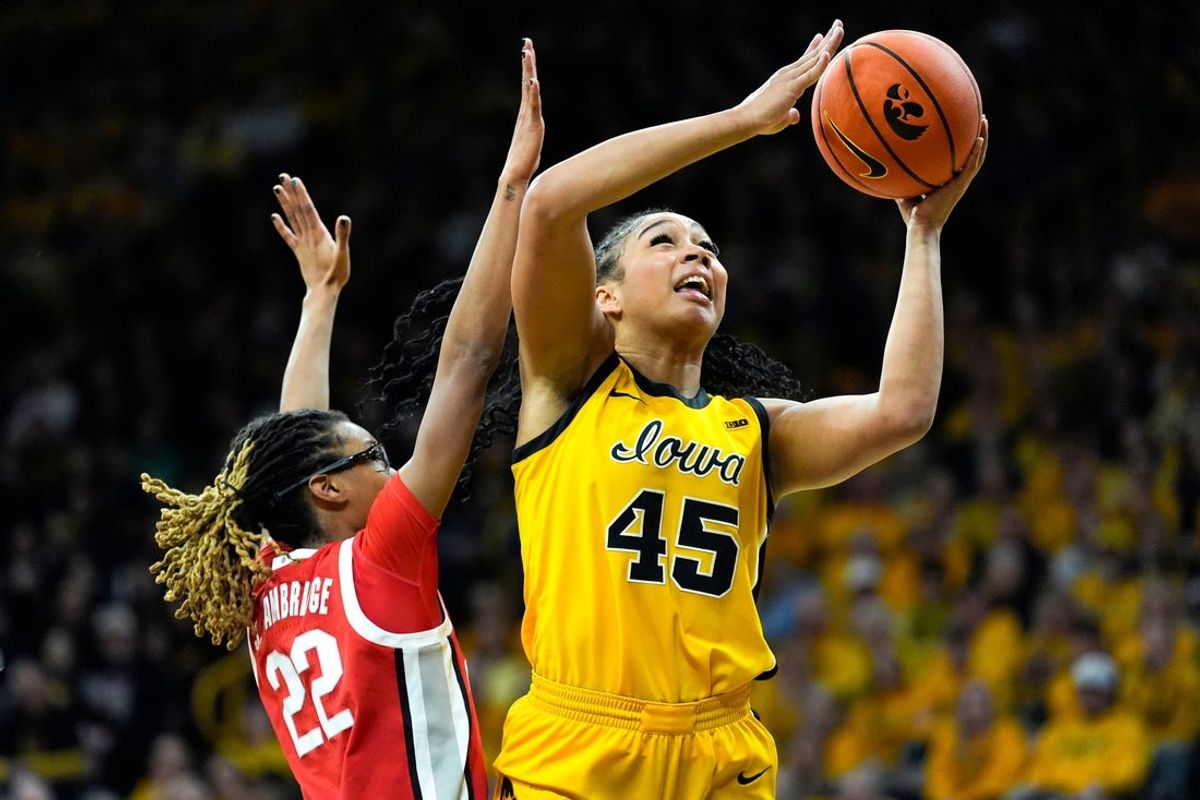 Iowa forward Hannah Stuelke (45) shoots the basketball against Ohio State guard Jaloni Cambridge (22) Jan. 25, 2026 at Carver-Hawkeye Arena in Iowa City, Iowa.