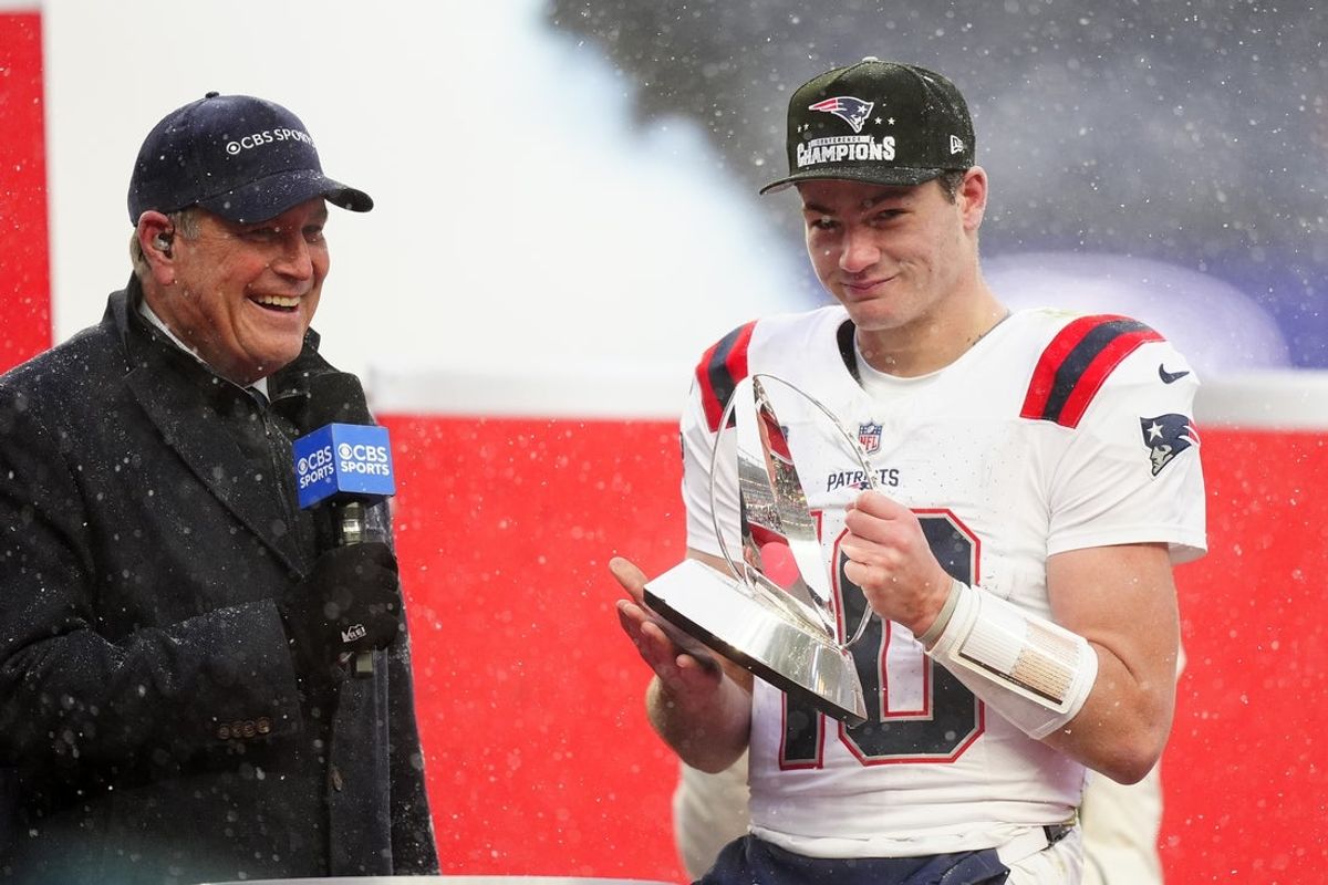 Jan 25, 2026; Denver, CO, USA; New England Patriots quarterback Drake Maye (10) holds the AFC Championship trophy while speaking to the media after defeating the Denver Broncos in the 2026 AFC Championship Game at Empower Field at Mile High. Mandatory Credit: Ron Chenoy-Imagn Images