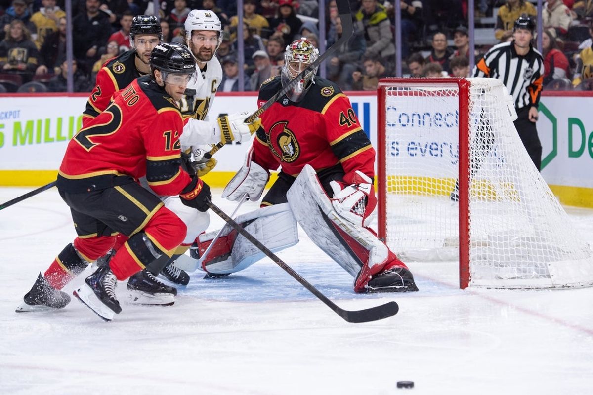 Jan 25, 2026; Ottawa, Ontario, CAN; Ottawa Senators center Shane Pinto (12) chases the puck following a save by goalie Mads Sogaard (40) in the second period against the Vegas Golden Knights  at the Canadian Tire Centre. Mandatory Credit: Marc DesRosiers-IMAGN Images