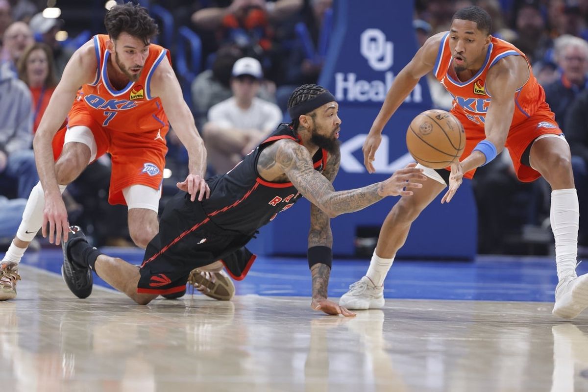 Jan 25, 2026; Oklahoma City, Oklahoma, USA; Toronto Raptors forward Brandon Ingram (3) and Oklahoma City Thunder guard Aaron Wiggins (21) reach for a loose ball during the first quarter at Paycom Center. Mandatory Credit: Alonzo Adams-Imagn Images