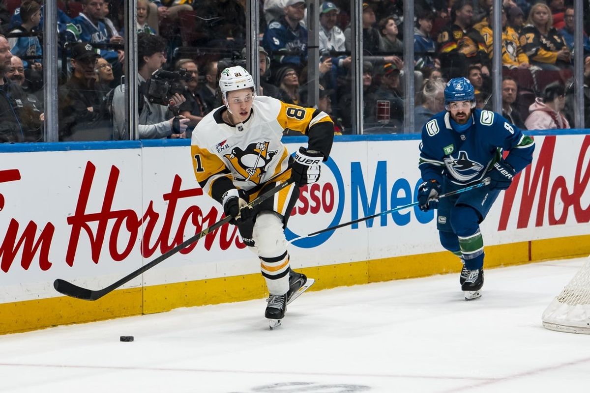 Jan 25, 2026; Vancouver, British Columbia, CAN; Vancouver Canucks forward Conor Garland (8) pursues Pittsburgh Penguins forward Ben Kindel (81) in the second period at Rogers Arena. Mandatory Credit: Bob Frid-Imagn Images