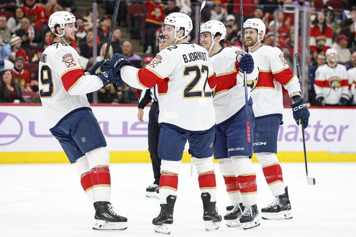 Jan 25, 2026; Chicago, Illinois, USA; Florida Panthers defenseman Tobias Bjornfot (22) celebrates with teammates after scoring against the Chicago Blackhawks during the second period at United Center. Mandatory Credit: Kamil Krzaczynski-Imagn Images