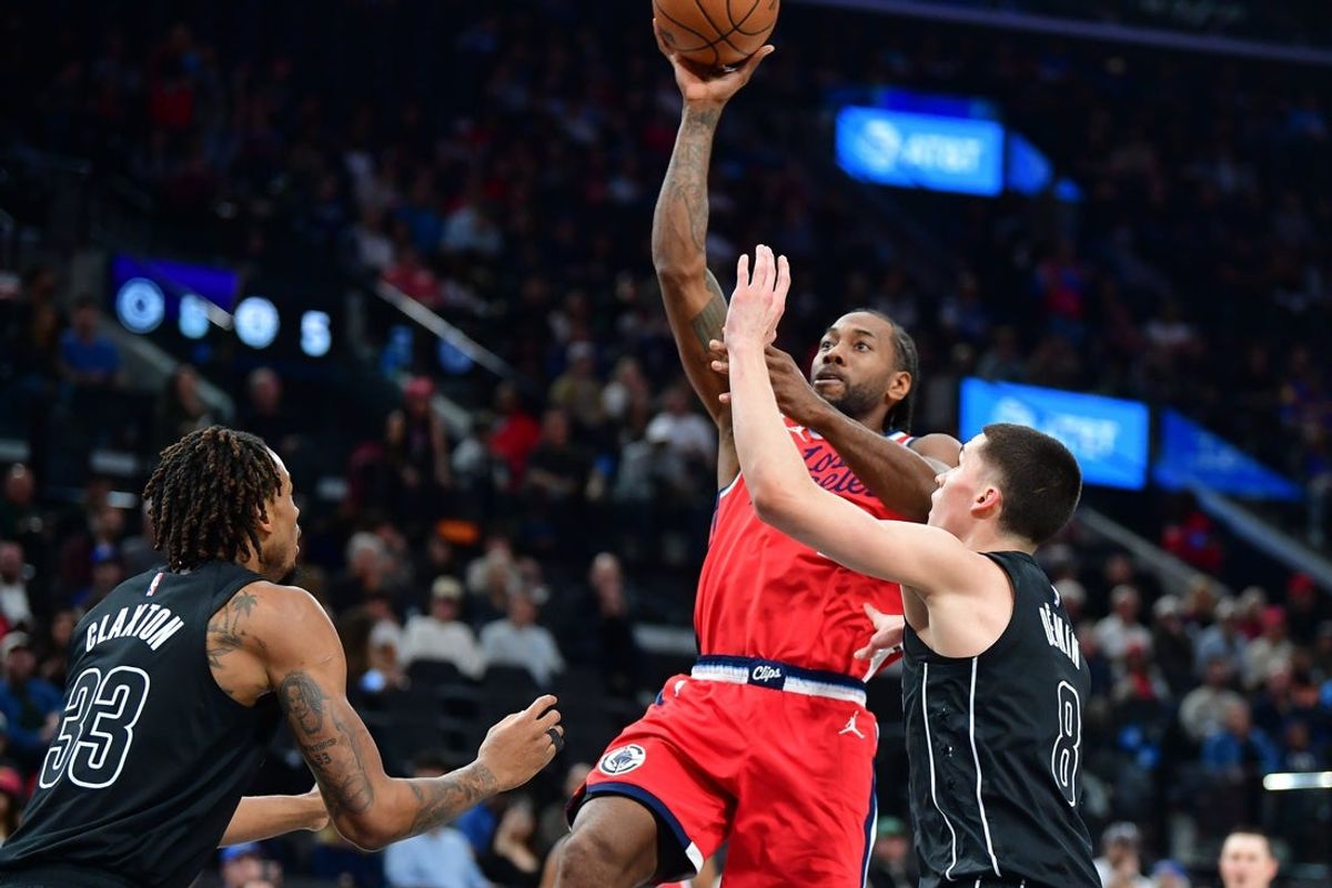 Jan 25, 2026; Inglewood, California, USA; Los Angeles Clippers forward Kawhi Leonard (2) shoots against Brooklyn Nets center Nic Claxton (33) and guard Egor Demin (8) during the first half at Intuit Dome. Mandatory Credit: Gary A. Vasquez-Imagn Images