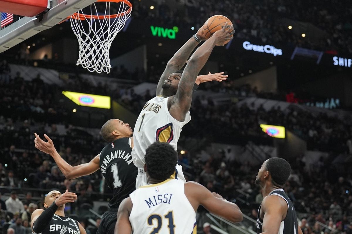 Jan 25, 2026; San Antonio, Texas, USA;  New Orleans Pelicans forward Zion Williamson (1) goes up against San Antonio Spurs forward Victor Wembanyama (1) in the second half at Frost Bank Center. Mandatory Credit: Daniel Dunn-Imagn Images