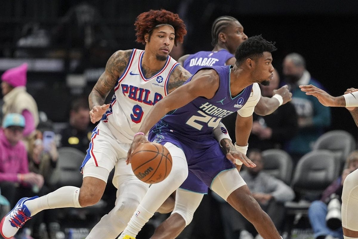 Jan 26, 2026; Charlotte, North Carolina, USA;  Charlotte Hornets forward Brandon Miller (24) handles the ball defended by Philadelphia 76ers forward/guard Kelly Oubre Jr. (9) during the first quarter at Spectrum Center. Mandatory Credit: Jim Dedmon-Imagn Images