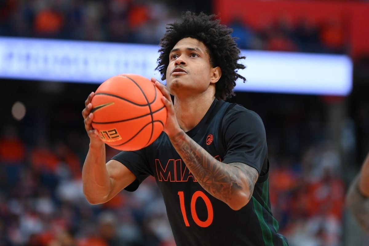 Jan 24, 2026; Syracuse, New York, USA; Miami Hurricanes guard Tru Washington (10) shoots a free throw during the first half against the Syracuse Orange at the JMA Wireless Dome. Mandatory Credit: Rich Barnes-Imagn Images