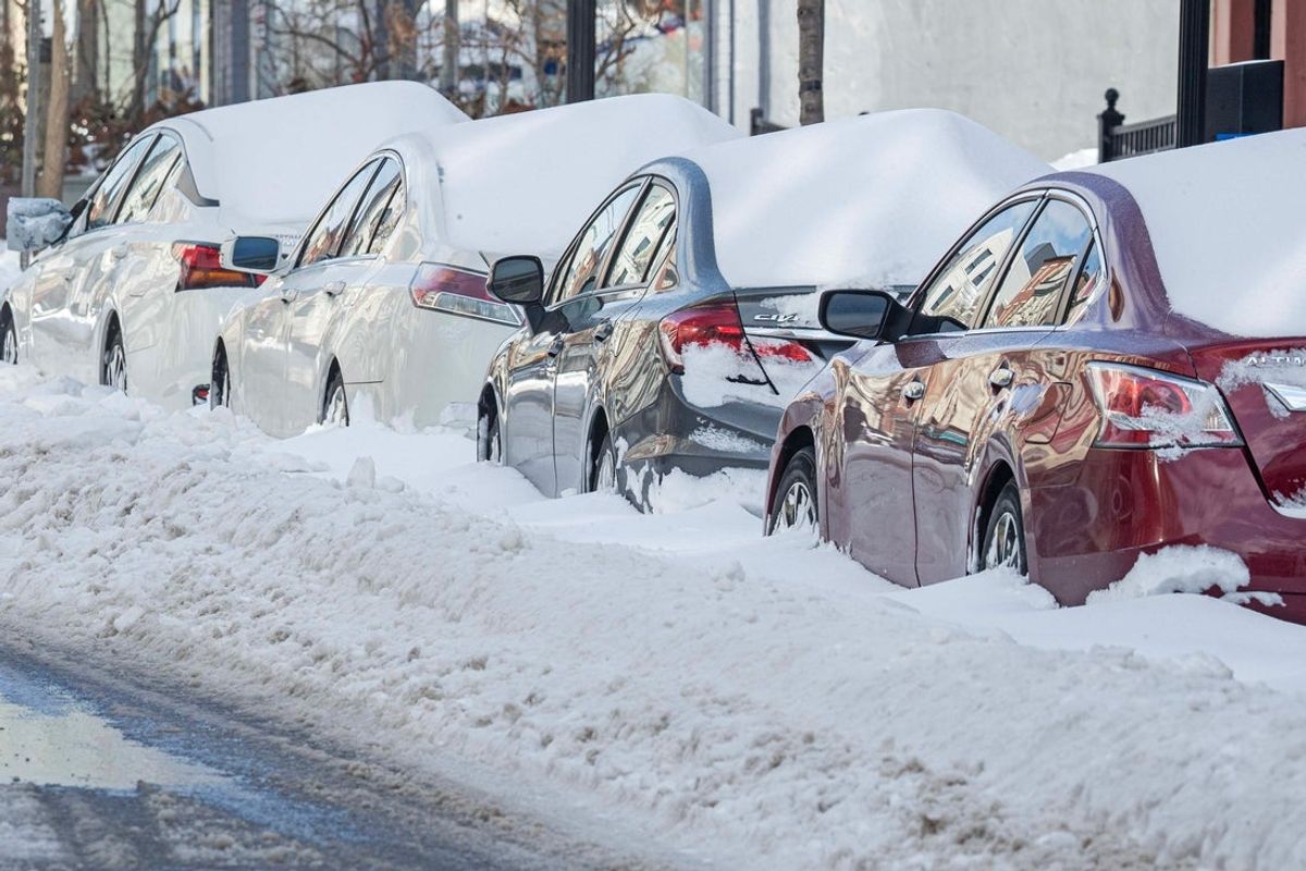Snow-covered cars in downtown Wilmington, Del., on Jan. 26, 2026.