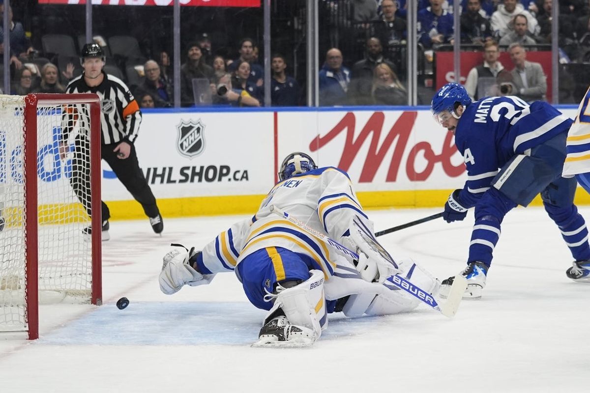 Jan 27, 2026; Toronto, Ontario, CAN; Toronto Maple Leafs forward Auston Matthews (34) scores on Buffalo Sabres goaltender Ukko-Pekka Luukkonen (1) during the first period at Scotiabank Arena. Mandatory Credit: John E. Sokolowski-Imagn Images