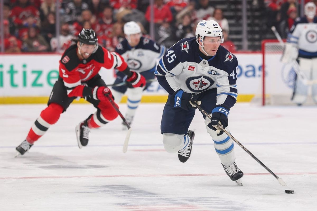 Jan 27, 2026; Newark, New Jersey, USA; Winnipeg Jets left wing Cole Koepke (45) skates with the puck against the New Jersey Devils during the first period at Prudential Center. Mandatory Credit: Ed Mulholland-Imagn Images