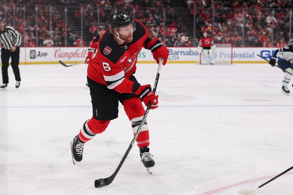 Jan 27, 2026; Newark, New Jersey, USA; New Jersey Devils right wing Connor Brown (16) shoots the puck against the Winnipeg Jets during the second period at Prudential Center. Mandatory Credit: Ed Mulholland-Imagn Images
