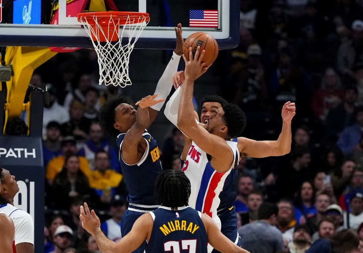 Jan 27, 2026; Denver, Colorado, USA; Denver Nuggets guard Peyton Watson (8) and forward Spencer Jones (21) defend on Detroit Pistons forward Tobias Harris (12) in the first quarter at Ball Arena. Mandatory Credit: Ron Chenoy-Imagn Images
