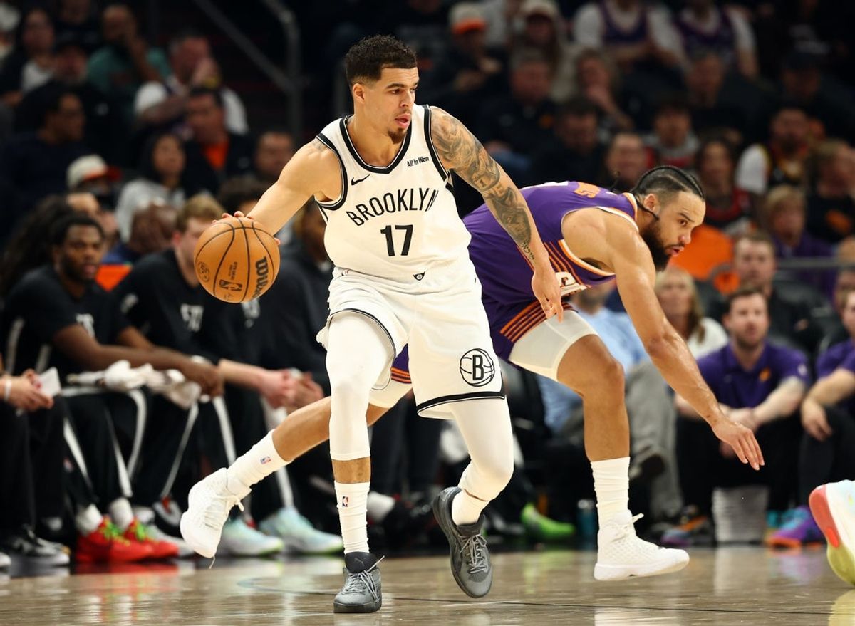 Jan 27, 2026; Phoenix, Arizona, USA; Brooklyn Nets forward Michael Porter Jr. (17) against Phoenix Suns forward Dillon Brooks (3) in the first half at Mortgage Matchup Center. Mandatory Credit: Mark J. Rebilas-Imagn Images