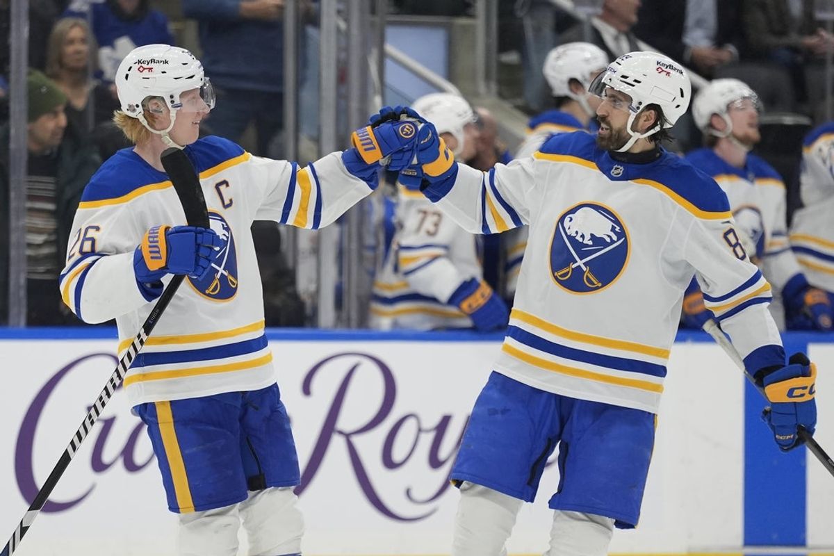 Jan 27, 2026; Toronto, Ontario, CAN; Buffalo Sabres forward Alex Tuch (89) congratulates defenseman Rasmus Dahlin (26) on his goal against the Toronto Maple Leafs during the third period at Scotiabank Arena. Mandatory Credit: John E. Sokolowski-Imagn Images