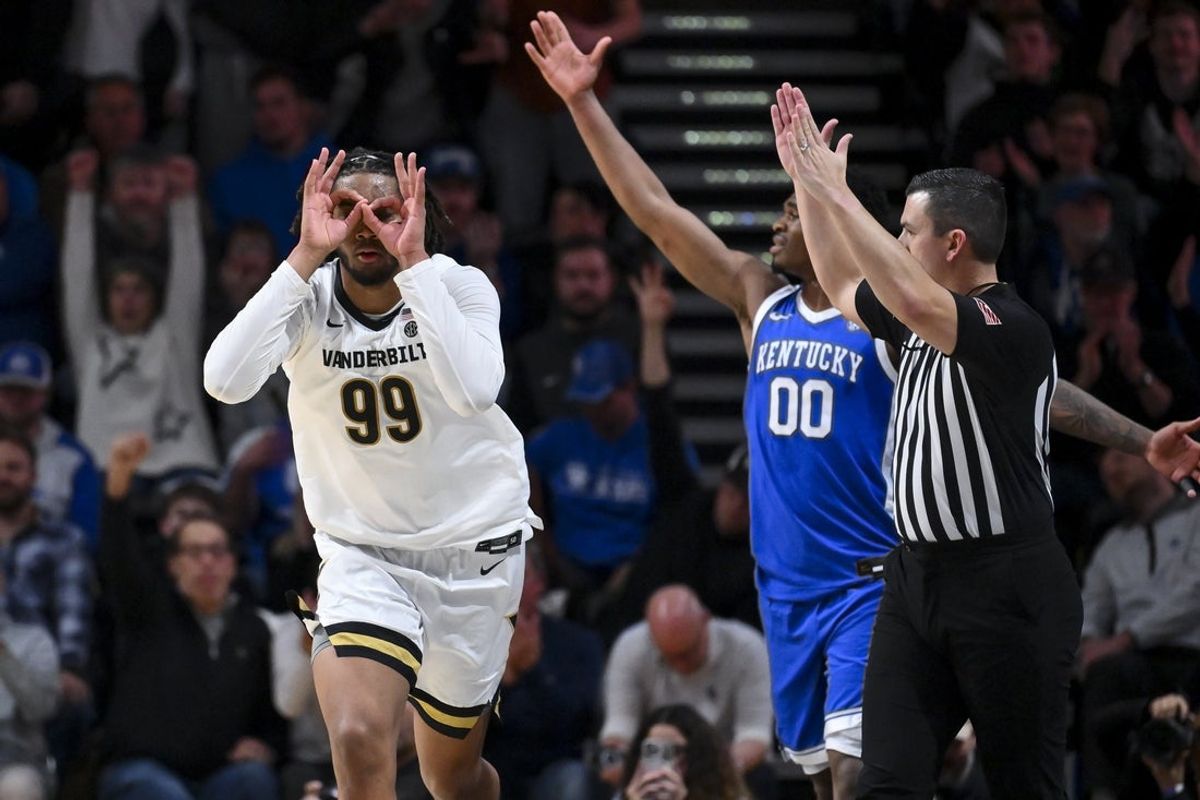 Jan 27, 2026; Nashville, Tennessee, USA;  Vanderbilt Commodores forward Devin McGlockton (99) reacts after a made three point basket against the Kentucky Wildcats during the first half at Memorial Gymnasium. Mandatory Credit: Steve Roberts-Imagn Images