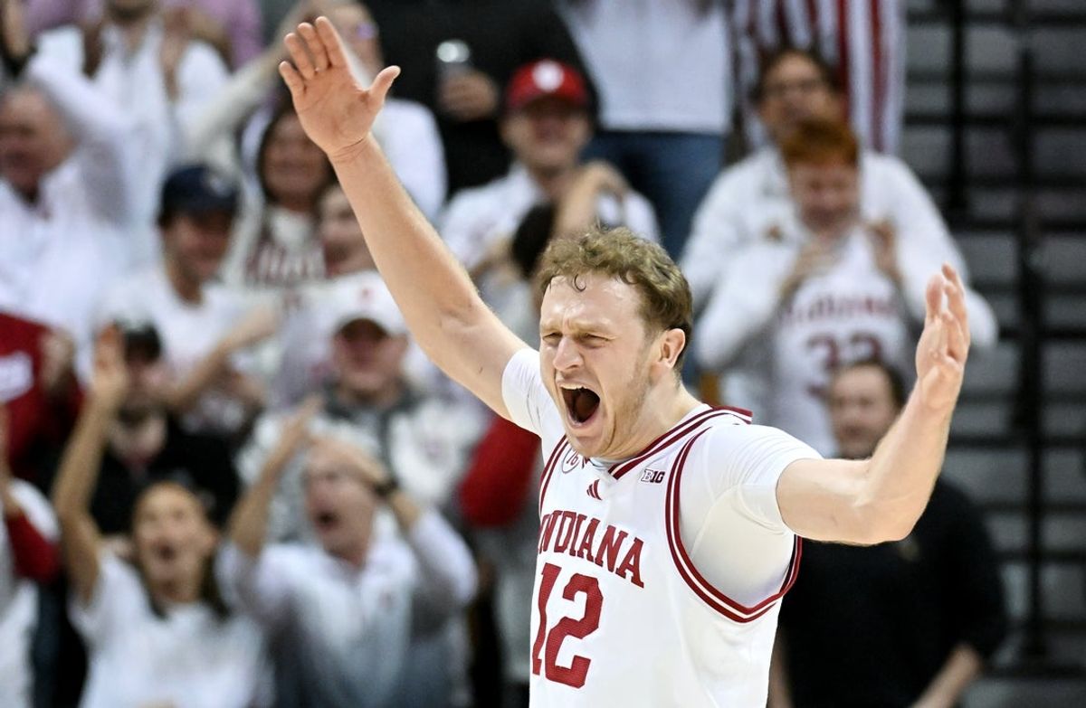 Jan 27, 2026; Bloomington, Indiana, USA; Indiana Hoosiers forward Tucker DeVries (12) celebrates after a play against the Purdue Boilermakers during the first half at Simon Skjodt Assembly Hall. Mandatory Credit: Robert Goddin-Imagn Images