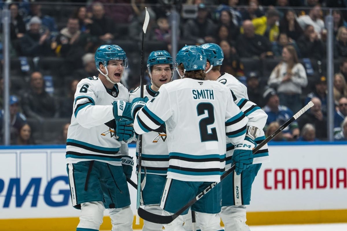 Jan 27, 2026; Vancouver, British Columbia, CAN; San Jose Sharks defenseman Sam Dickinson (6) and forward Macklin Celebrini (71) and forward Will Smith (2) and defenseman John Klingberg (3) celebrate Celebrini’s goal against the Vancouver Canucks in the first period at Rogers Arena. Mandatory Credit: Bob Frid-Imagn Images