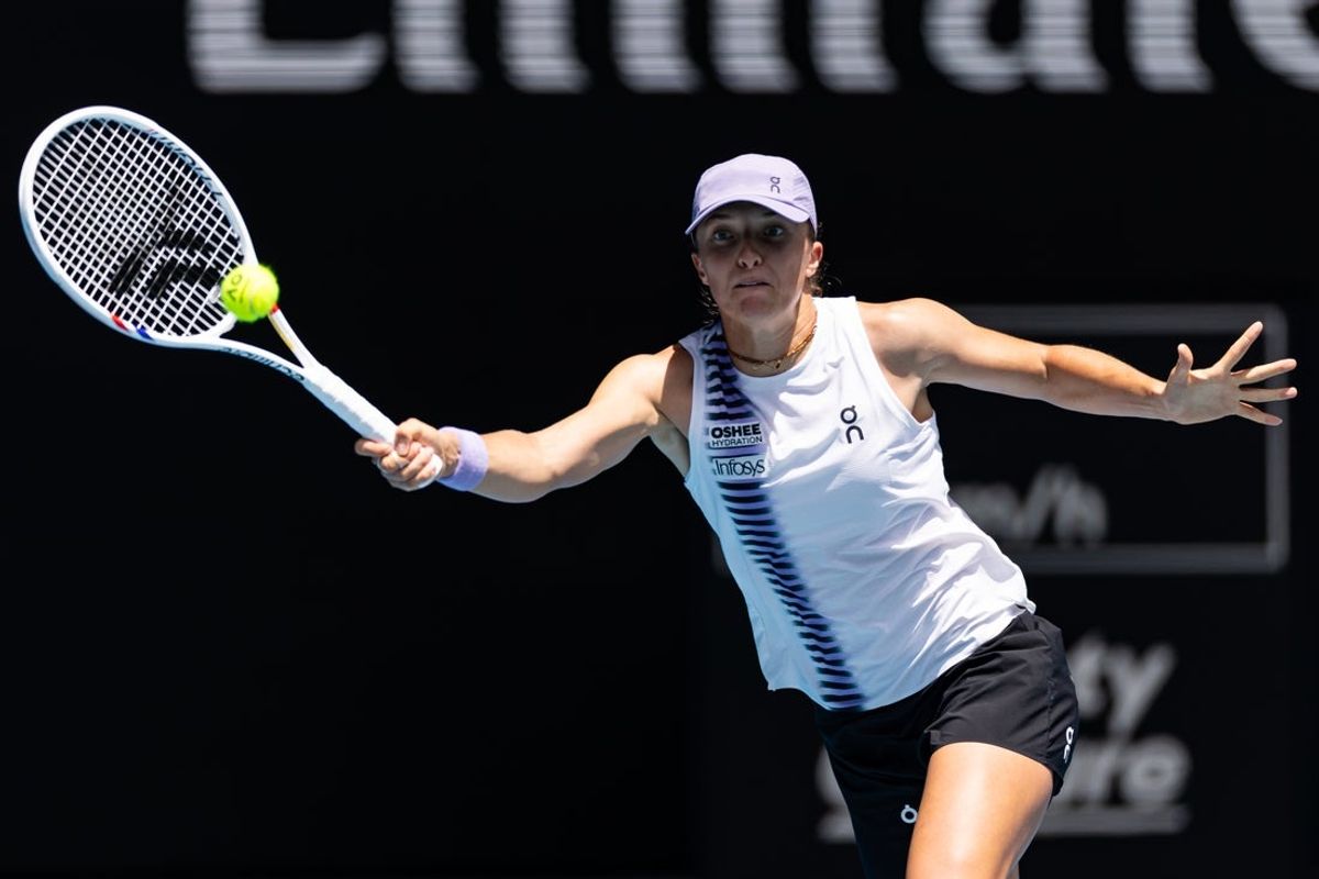 Jan 28, 2026; Melbourne, Victoria, Australia; Iga Swiatek of Poland in action against Elena Rybakina of Kazakhstan in the quarterfinals of the women’s singles at the Australian Open at Rod Laver Arena in Melbourne Park. Mandatory Credit: Mike Frey-Imagn Images