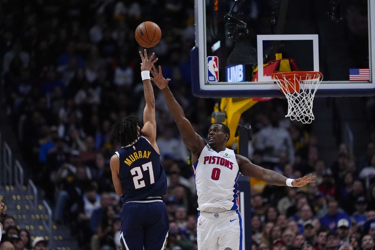 Jan 27, 2026; Denver, Colorado, USA; Denver Nuggets guard Jamal Murray (27) shoots the ball over Detroit Pistons center Jalen Duren (0) in the fourth quarter  at Ball Arena. Mandatory Credit: Ron Chenoy-Imagn Images