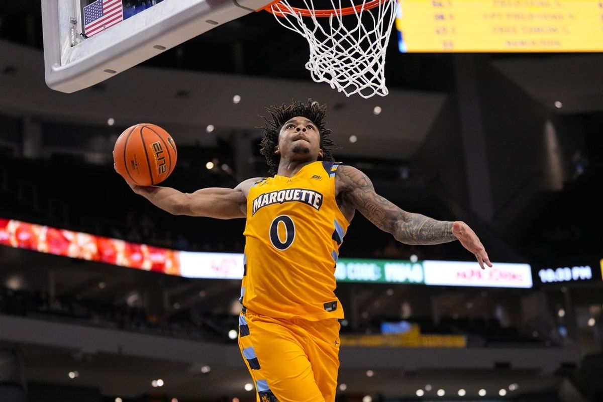 Jan 27, 2026; Milwaukee, Wisconsin, USA;  Marquette Golden Eagles guard Nigel James Jr. (0) dunks during the second half against the Creighton Bluejays at Fiserv Forum. Mandatory Credit: Jeff Hanisch-Imagn Images