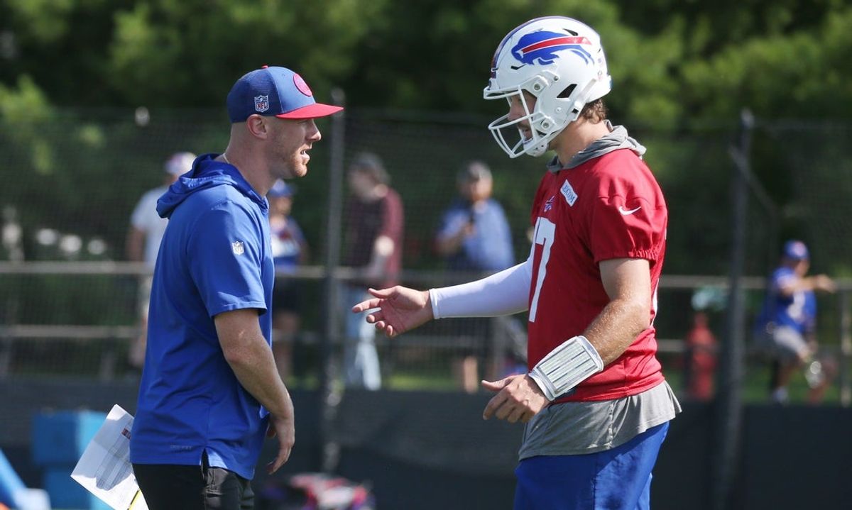 Bills quarterback Josh Allen talks with offensive coordinator Joe Brady during drills on day three of the Buffalo Bills training camp.