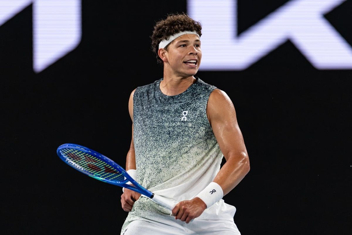 Jan 28, 2026; Melbourne, Victoria, Australia; Ben Shelton of United States in action against Jannik Sinner of Italy in the quarterfinals of the menís singles at the Australian Open at Rod Laver Arena in Melbourne Park. Mandatory Credit: Mike Frey-Imagn Images